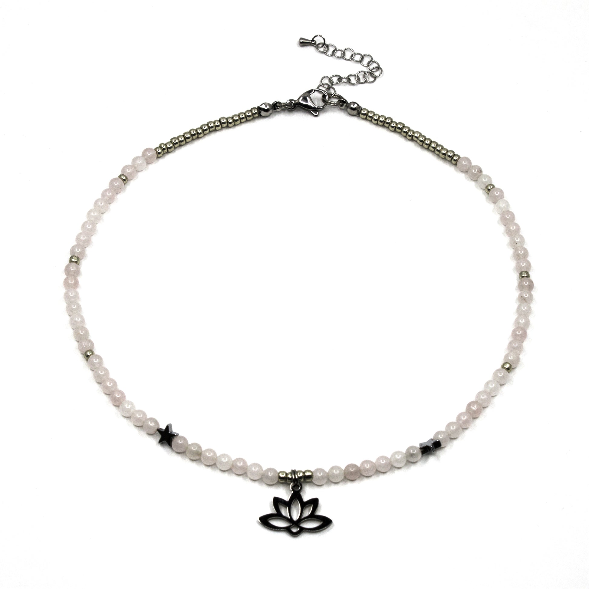 Gemstone choker necklace with pink beads and a silver lotus charm on a white surface